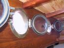 The brass/ bronze portholes are antique items sourced at Beaulieu Boat Jumble.